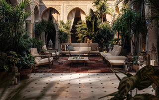 Courtyard with seating and lush plants.