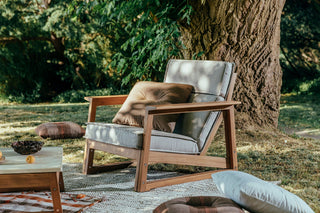 Didier TanGuor outdoor chair with cushions in natural setting