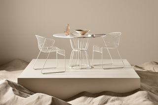 ND chairs and table set against a neutral background