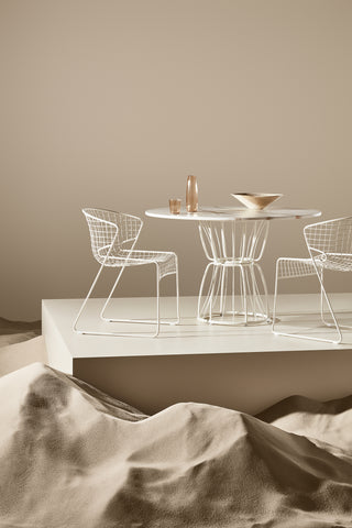 ND styled chairs and a table on a neutral background