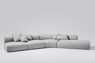 Modern gray sectional sofa with pillows