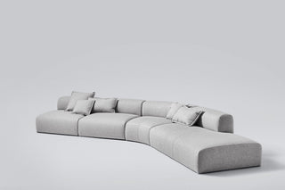 Gray sectional sofa with pillows.