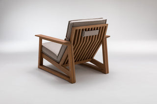 Wooden armchair with gray cushions.
