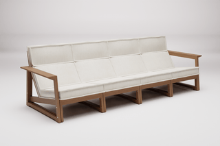 Four-seat outdoor sofa with light cushions and wooden frame.