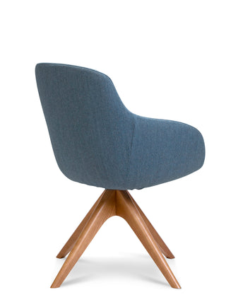 Blue upholstered chair with wooden legs on a white background