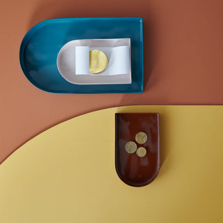 Colorful trays with coins and accessories