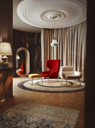 Elegant living room with red chair, DID Apparel vignette.