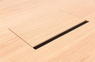 Close-up of wooden table with inset