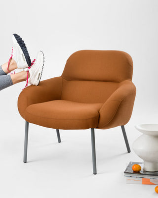 Modern orange chair with sneakers