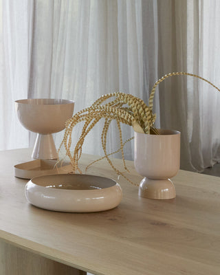 Pink goblet planters with decorative feathers
