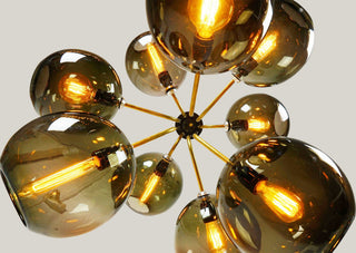 ILANEL Tree of Light chandelier with glowing bulbs.