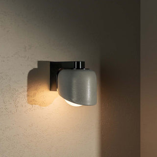 MARZ Terra 0.5 Fog Brushed Black wall sconce on textured wall.