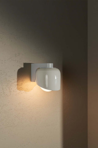 MARZ Terra 0.5 Vanilla White Satin wall sconce on portrait