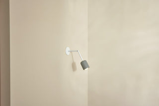 Marz Designs Terra 1 articulating wall lamp, white satin, on wall