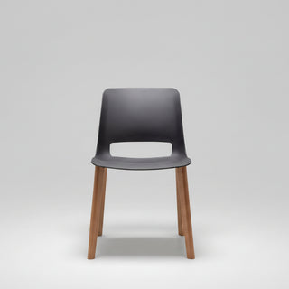 Chair with dark gray seat and wooden legs on a white background