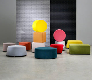 Assorted colorful ottomans in modern arrangement