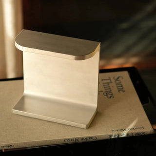 Aluminum desk lamp on book