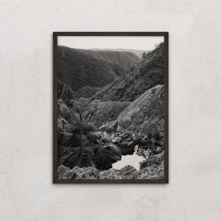 Tia Falls framed black and white landscape on wall