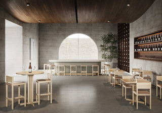 Interior of a modern bar with tables and chairs.