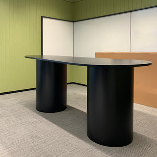 Black drum table in modern office