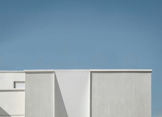 Modern building with a minimal design against a clear blue sky