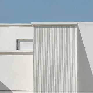 Modern building with a minimal design against a clear blue sky