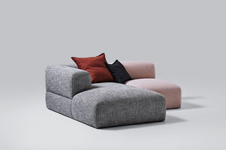 Puffalo Lounge sectional sofa with red and black pillows