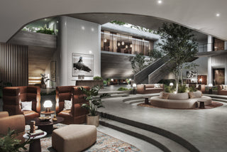 Lobby with seating, trees, and modern architecture.