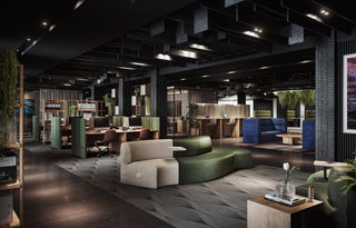 Modern office interior with seating and desks.