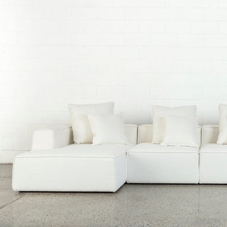 Baxter4 white sectional sofa with pillows