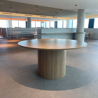 Round drum table in a bar setting