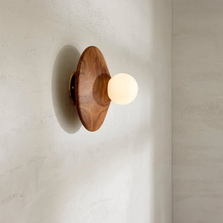 Marz Designs walnut wall sconce with brass and opal bulb