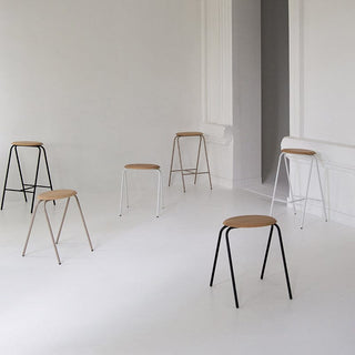 Modern stools with wood seats in minimalist room