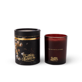 Southern Wild Co. candle with floral accents