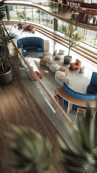 Modern interior with seating and plants.