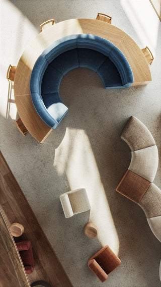 Overhead view of a circular booth with seating and other furniture.