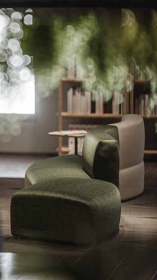Green and tan modern chair in a room.