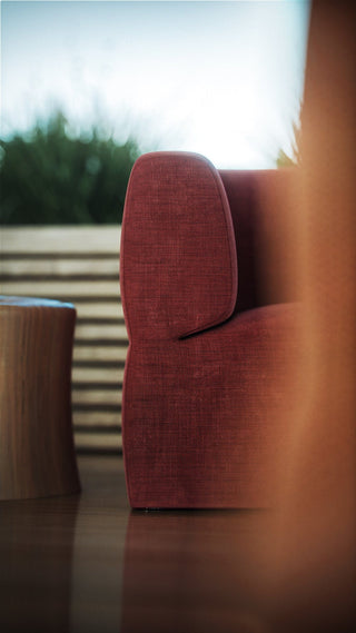Red upholstered chair and side table.