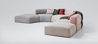 Puffalolounge4 sectional sofa with colorful cushions.